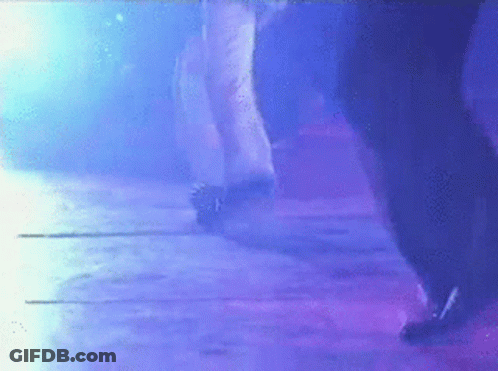 Person Dancing In Dark Room With Purple Lights GIF