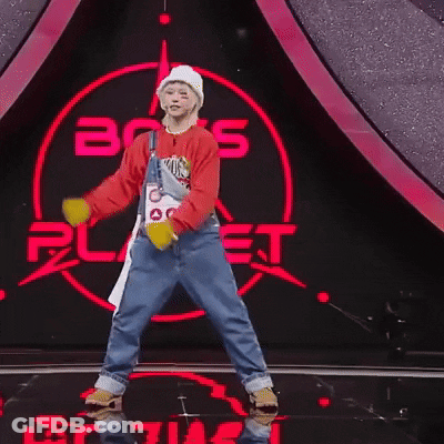Person Dancing In Front Of Boys Planet Sign GIF