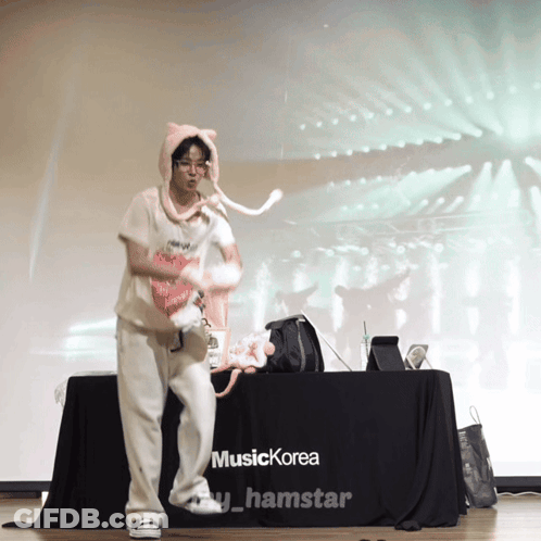 Person Dancing In Front Of Music Korea Table GIF