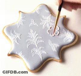Person Decorating Cookie With Brush GIF