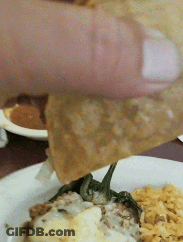 Person Dipping Food Into Plate GIF