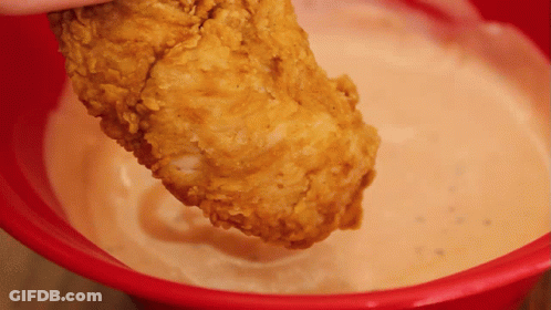Person Dipping Fried Chicken In Sauce GIF
