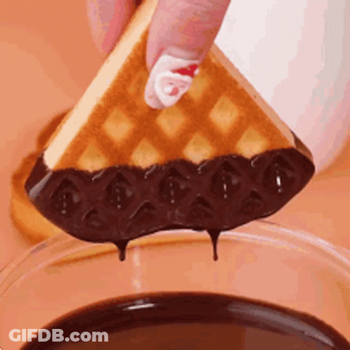 Person Dipping Waffle Into Chocolate Sauce GIF