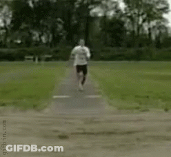 Person Doing Handstand In Dirt In Park GIF