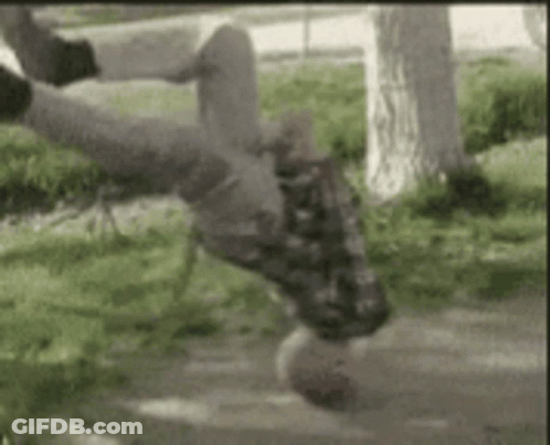 Person Doing Handstand On Skateboard In Park GIF