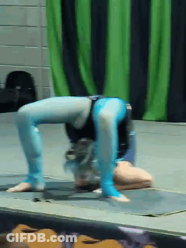 Person Doing Handstand On Stage GIF