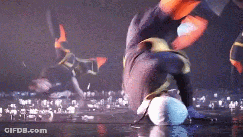 Person Doing Handstand On Stage With Crowd GIF