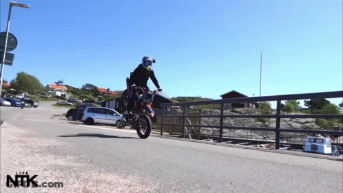 Person Doing Motorcycle Trick With NTK GIF