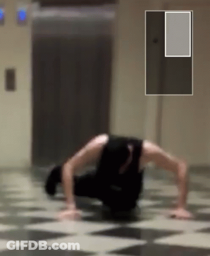 Person Doing Push Ups On Checkered Floor GIF
