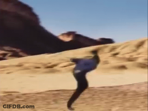 Person Doing Trick On Sand Dune GIF