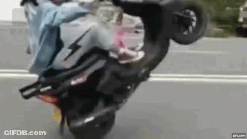 Person Doing Wheelie On Motorcycle GIF