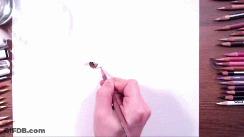 Person Drawing Cat Eye With Brown Pencil GIF
