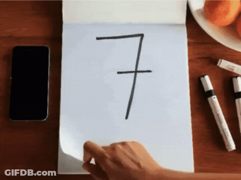 Person Drawing Number Seven On Paper GIF