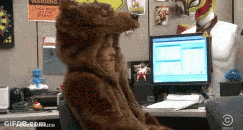 Person Dressed As Bear At Computer GIF