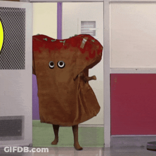 Person Dressed As Pizza With Googly Eyes Walking Through Doorway GIF