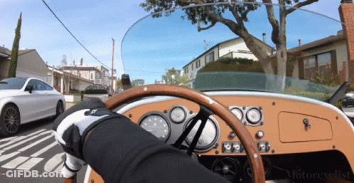 Person Driving Car With Motorcyclist Text GIF