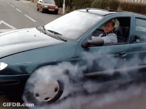 Person Driving Car With Smoke From Tire GIF