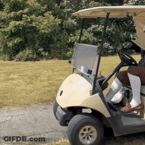 Person Driving EZGO Golf Cart GIF