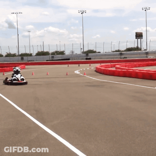 Person Driving Go Kart Down Track GIF