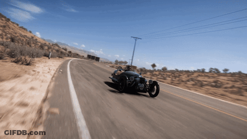 Person Driving Three-Wheeled Vehicle On Desert Road GIF