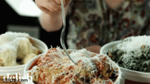 Person Eating Bowl Of Food With Fork Saying Delish GIF