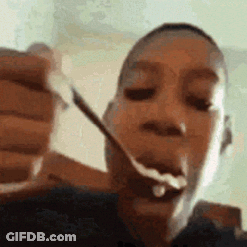 Person Eating Food With Spoon GIF
