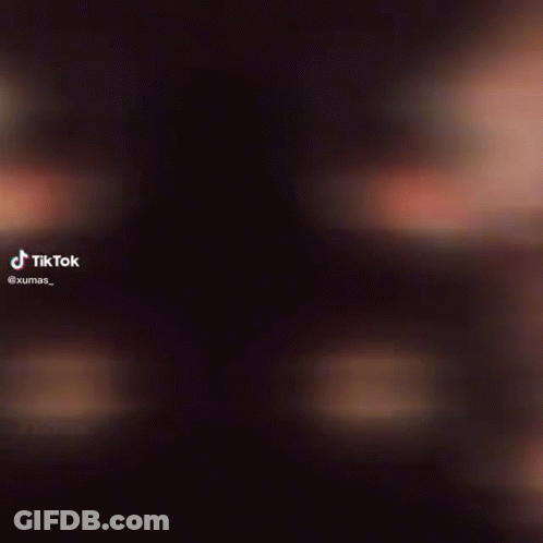 Person Face Close-Up With TikTok Logo GIF