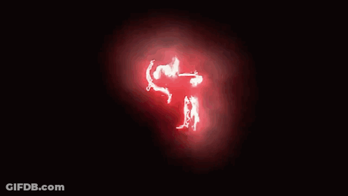 Person Face Glowing Red In Dark GIF