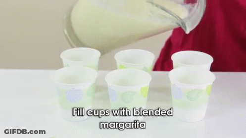 Person Filling Cups With Margarita GIF