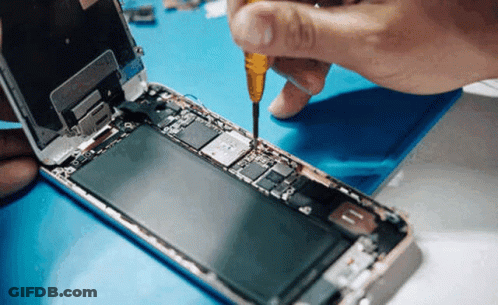 Person Fixing Cell Phone With Screwdriver GIF