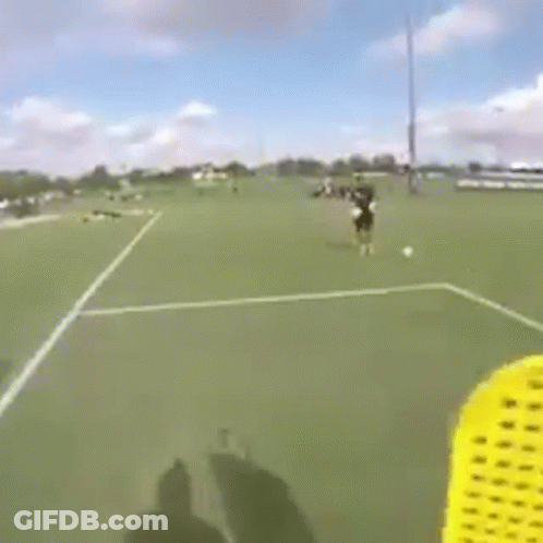 Person Flying Frisbee On Soccer Field GIF