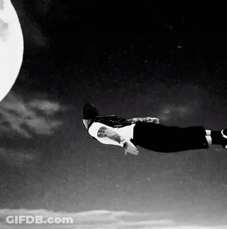 Person Flying In Front Of Full Moon GIF