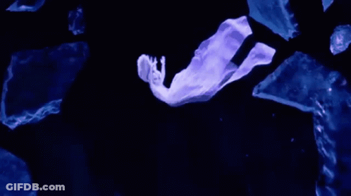 Person Flying Through Dark With Stick GIF