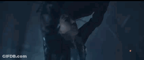 Person Flying With Sword In Dark Room GIF