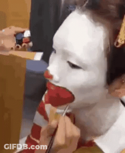 Person Getting Clown Face Paint GIF
