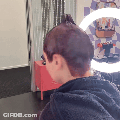 Person Getting Hair Dyed In Front Of Mirror With 200 GIF