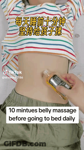 Person Giving Child Belly Massage Before Bed GIF