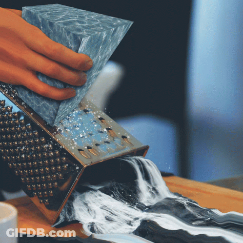 Person Grating Water Into Waterfall GIF