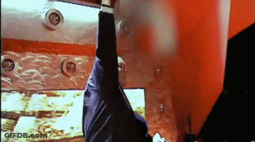 Person Hanging Upside Down In Red Room GIF
