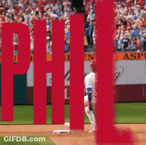 Person Hanging Upside Down Next To Red Stop Sign GIF