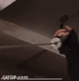 Person Hanging Wire From Ceiling GIF