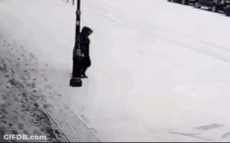 Person Hilariously Slipping On Ice While Walking GIF