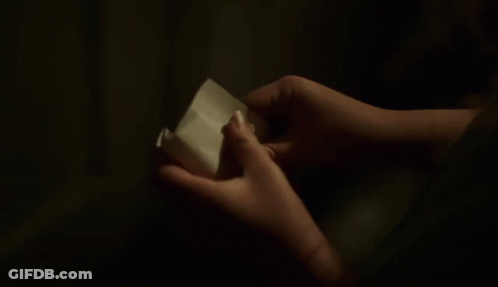 Person Holding A Piece Of Paper That Says In Here GIF