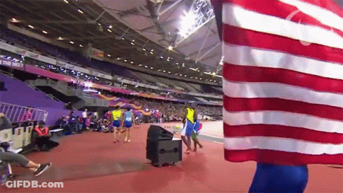Person Holding American Flag In Stadium Saying The New GIF