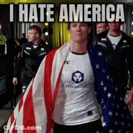 Person Holding American Flag Saying I Hate America GIF