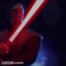 Person Holding And Lighting Up Light Saber GIF