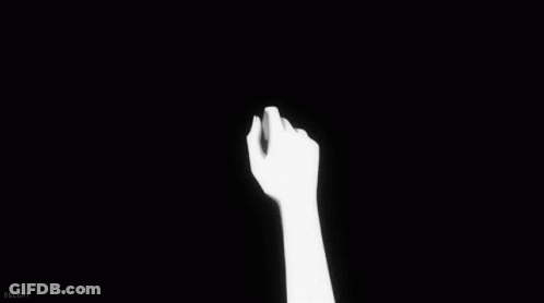 Person Holding Another Person's Hand In Black And White GIF