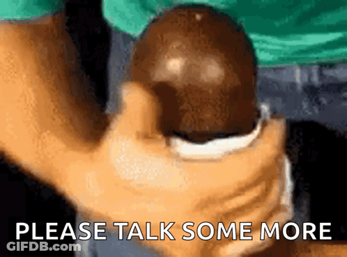 Person Holding Ball Saying Please Talk Some More GIF