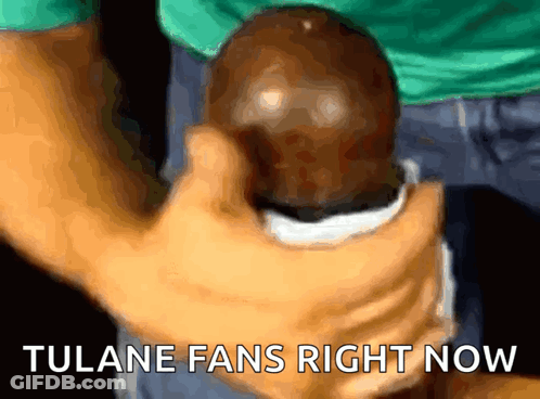 Person Holding Ball Saying Tulane Fans Right Now GIF