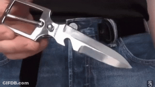 Person Holding Belt Buckle With Knife GIF